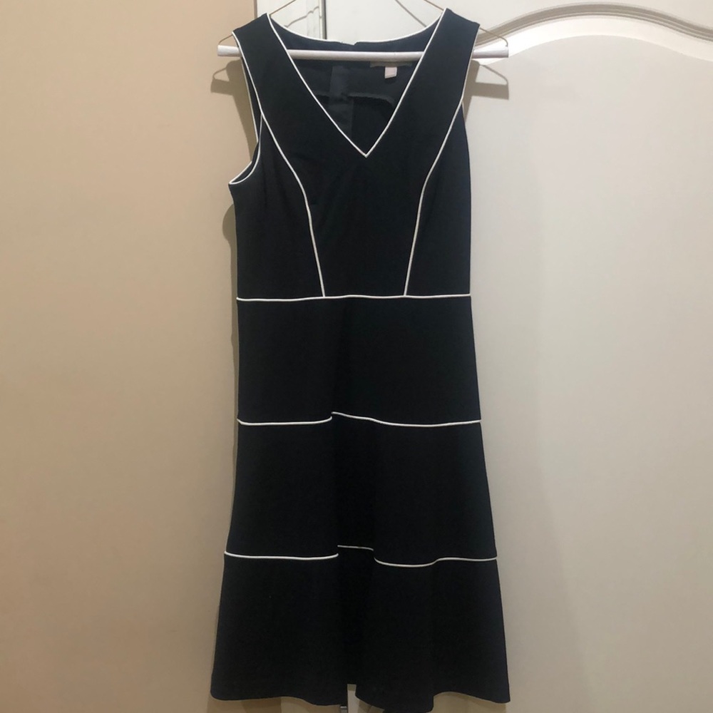 Black and white trimmed dress.